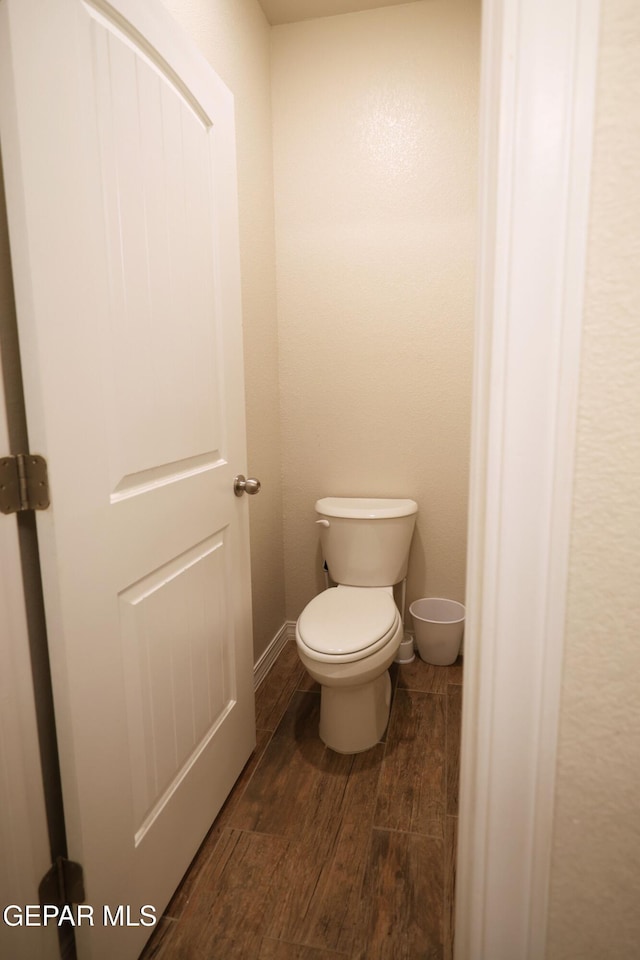 1628 Sam Dominguez, El Paso, TX 79928 - bathroom featuring wood finished floors and toilet