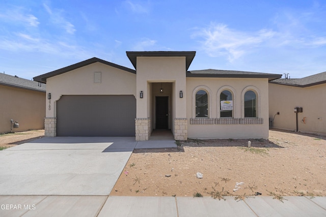 3780 Surmise St, El Paso, TX 79938 - view of front of house featuring an attached garage, stucco siding, and concrete driveway