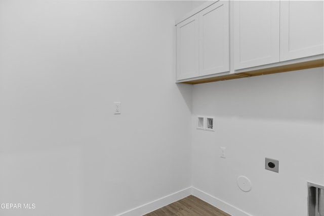 3780 Surmise St, El Paso, TX 79938 - laundry area with hookup for an electric dryer, baseboards, cabinet space, wood finished floors, and hookup for a gas dryer