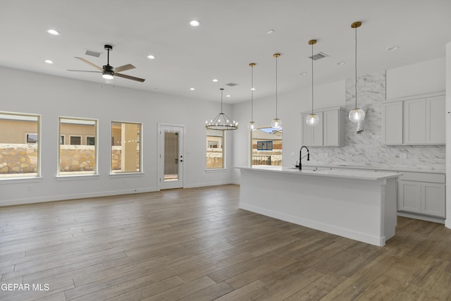 3780 Surmise St, El Paso, TX 79938 - kitchen with open floor plan, a ceiling fan, tasteful backsplash, recessed lighting, and an island with sink