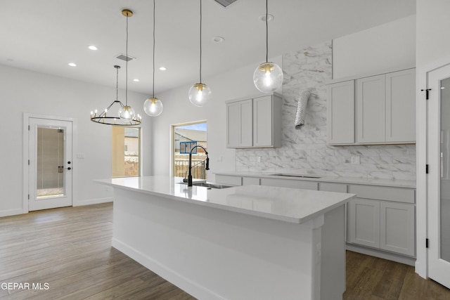 3780 Surmise St, El Paso, TX 79938 - kitchen featuring a sink, decorative backsplash, light countertops, wood finished floors, and recessed lighting
