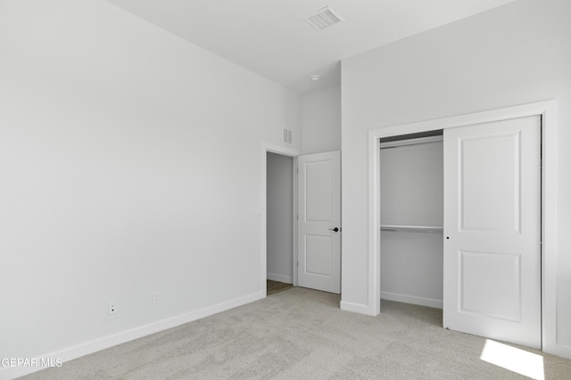 3749 Focus Pl, El Paso, TX 79938 - unfurnished bedroom featuring light carpet, baseboards, and a closet