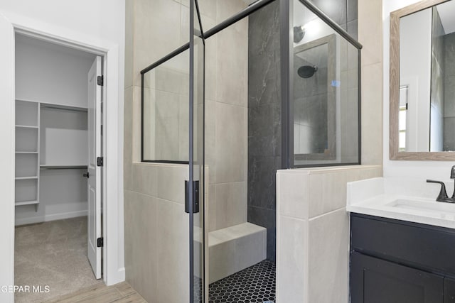 3749 Focus Pl, El Paso, TX 79938 - bathroom featuring a shower stall, a spacious closet, and vanity