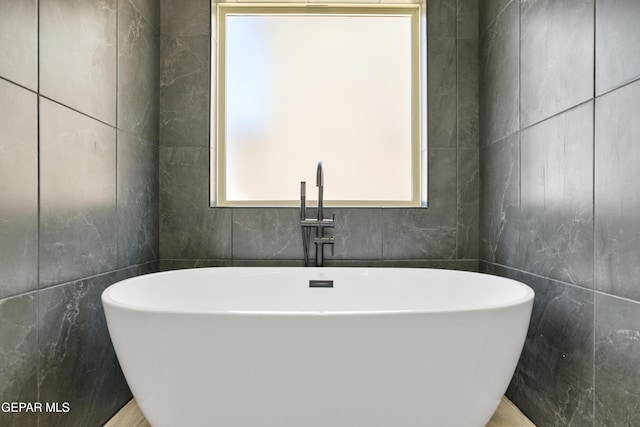 3749 Focus Pl, El Paso, TX 79938 - full bathroom featuring tile walls and a freestanding bath