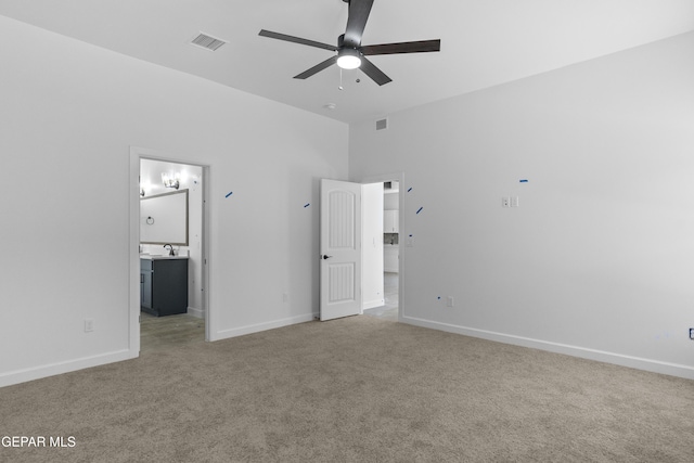 unfurnished bedroom featuring visible vents, baseboards, and light colored carpet