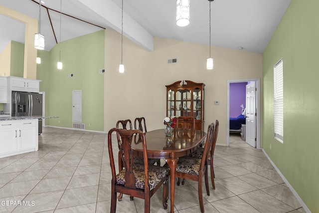 dining space featuring high vaulted ceiling, baseboards, light tile patterned flooring, and visible vents