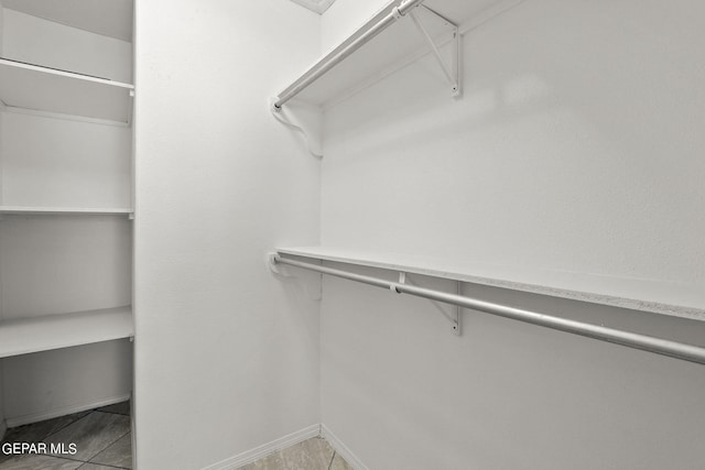 walk in closet featuring tile patterned floors