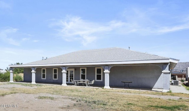 view of front of home featuring a porch and central AC unit