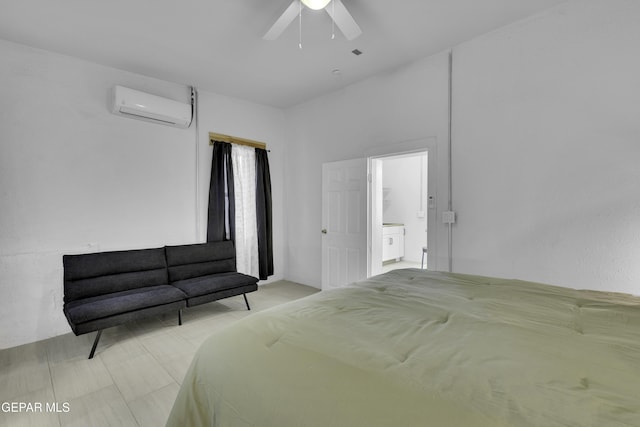 bedroom featuring a wall mounted AC and ceiling fan
