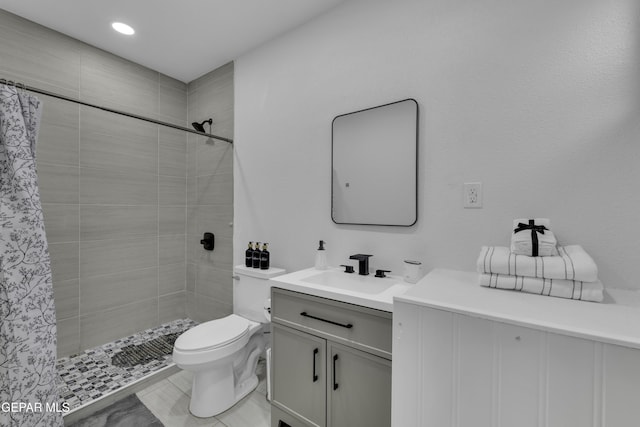 full bath featuring toilet, vanity, recessed lighting, and a tile shower