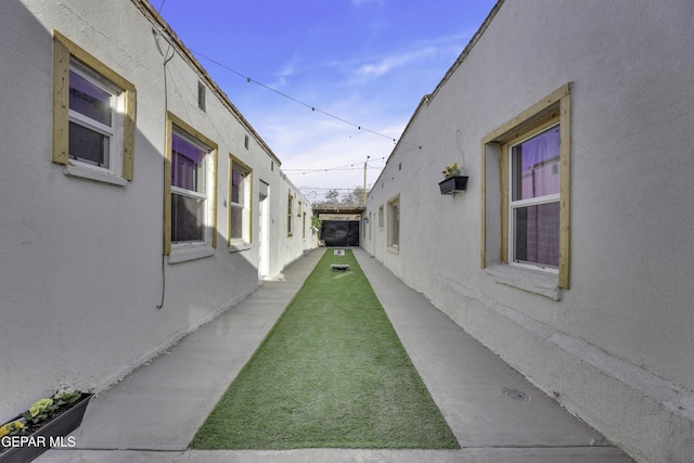 view of side of home with stucco siding