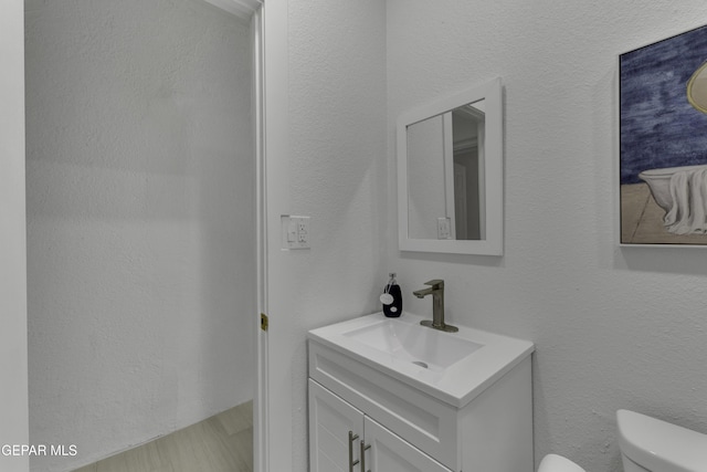half bath with toilet and vanity