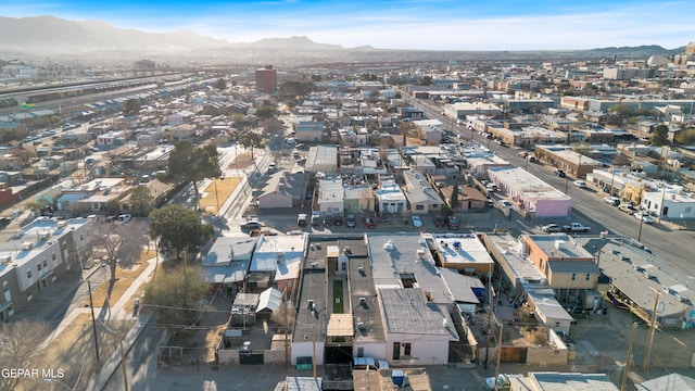 birds eye view of property with a mountain view