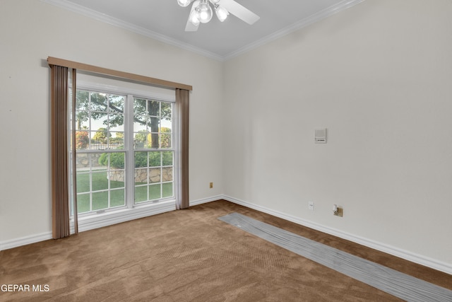 empty room featuring baseboards, ornamental molding, carpet flooring, and ceiling fan