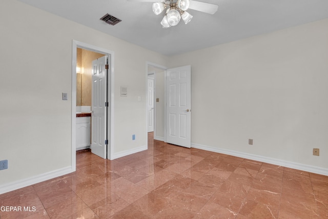 unfurnished bedroom featuring baseboards, visible vents, and marble finish floor