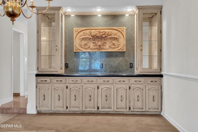 bar featuring an inviting chandelier, baseboards, tasteful backsplash, and recessed lighting