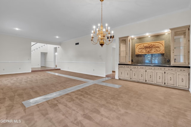unfurnished living room featuring baseboards, an inviting chandelier, ornamental molding, and light carpet
