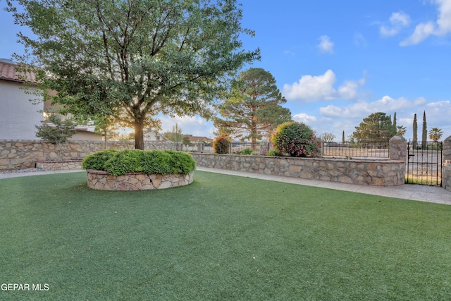 view of yard with a gate and fence private yard