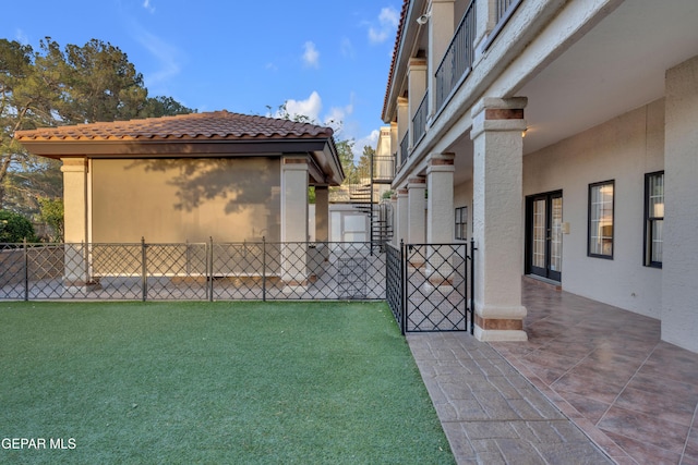 view of yard with fence, stairs, and a patio area