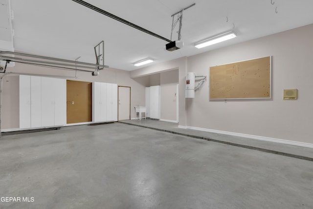 garage featuring baseboards and a garage door opener