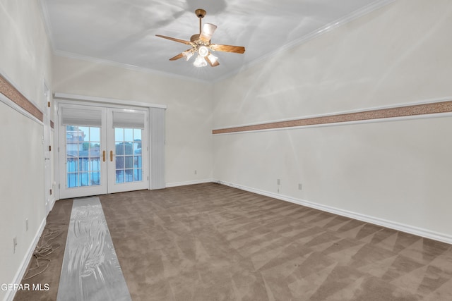 unfurnished living room with carpet flooring, crown molding, french doors, a ceiling fan, and baseboards