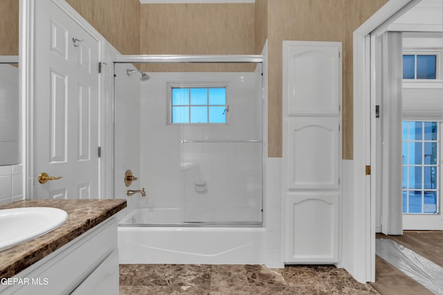 full bathroom with vanity and enclosed tub / shower combo