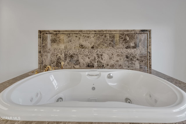details featuring a tub with jets