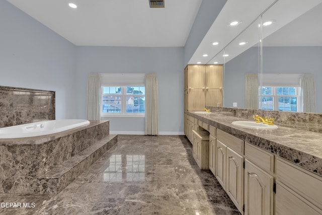 bathroom featuring vanity, recessed lighting, baseboards, visible vents, and a garden tub