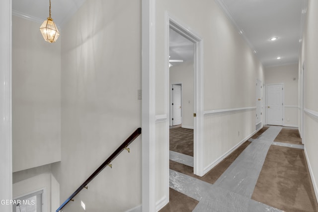 corridor with crown molding, carpet flooring, recessed lighting, baseboards, and an upstairs landing