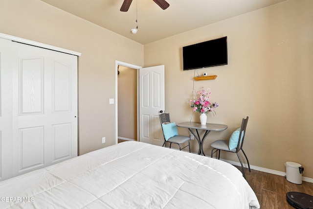 bedroom with wood finished floors, baseboards, and ceiling fan