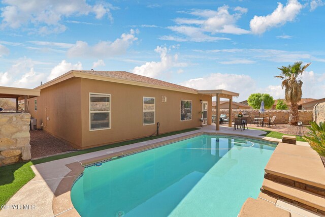 view of pool with a fenced in pool, a patio, and fence