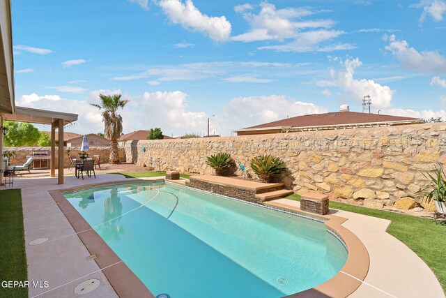 view of pool with a patio area, a fenced backyard, and a fenced in pool