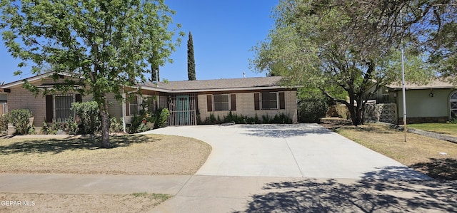 2704 Gaston Dr, El Paso, TX 79935 - single story home with driveway, fence, and brick siding