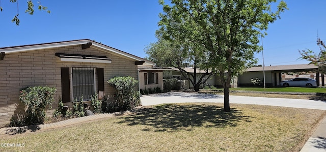 2704 Gaston Dr, El Paso, TX 79935 - single story home featuring a front lawn and driveway