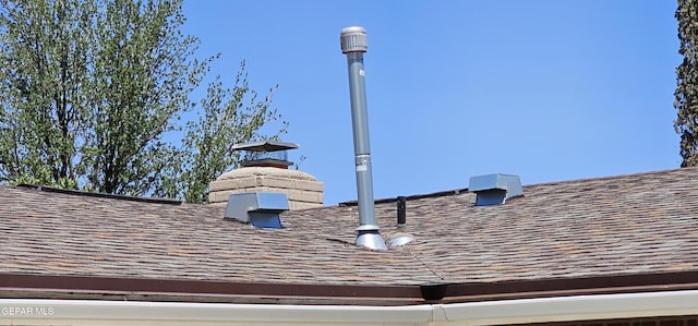 2704 Gaston Dr, El Paso, TX 79935 - details featuring a shingled roof and a chimney