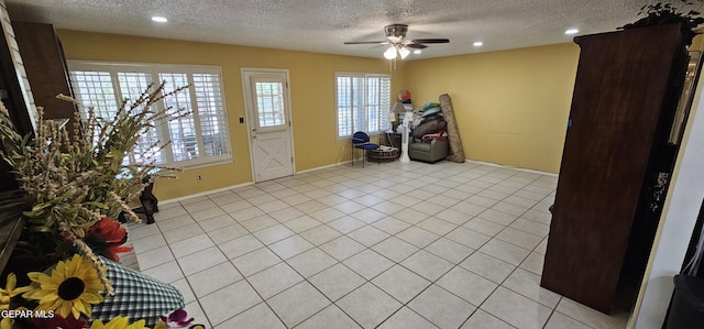 2704 Gaston Dr, El Paso, TX 79935 - foyer entrance with light tile patterned floors, recessed lighting, a textured ceiling, and a ceiling fan