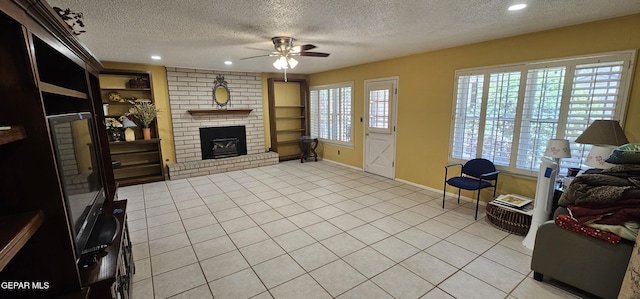 2704 Gaston Dr, El Paso, TX 79935 - living room with recessed lighting, a ceiling fan, a textured ceiling, and a brick fireplace