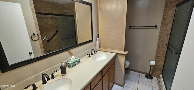 2704 Gaston Dr, El Paso, TX 79935 - bathroom featuring tile patterned floors, double vanity, toilet, a sink, and a stall shower