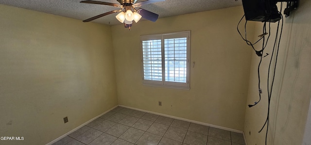 2704 Gaston Dr, El Paso, TX 79935 - unfurnished room featuring baseboards, light tile patterned floors, ceiling fan, and a textured ceiling