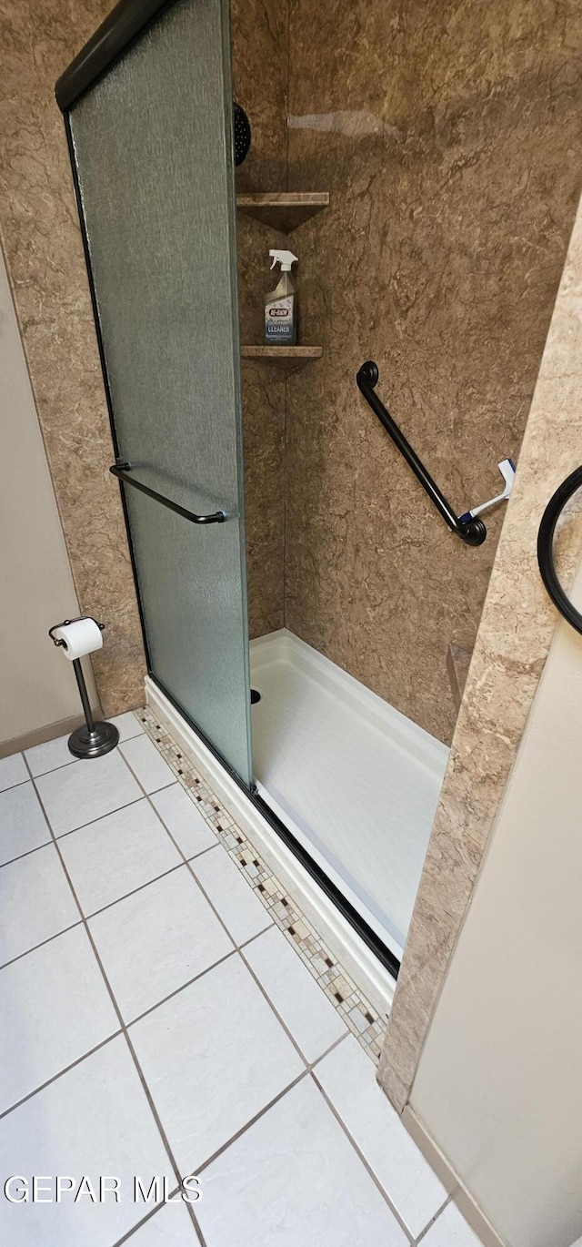 2704 Gaston Dr, El Paso, TX 79935 - full bathroom featuring tile patterned floors and a stall shower