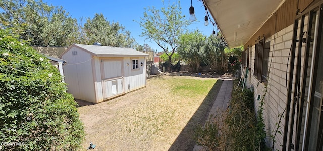 2704 Gaston Dr, El Paso, TX 79935 - view of yard with fence, an outdoor structure, and a shed