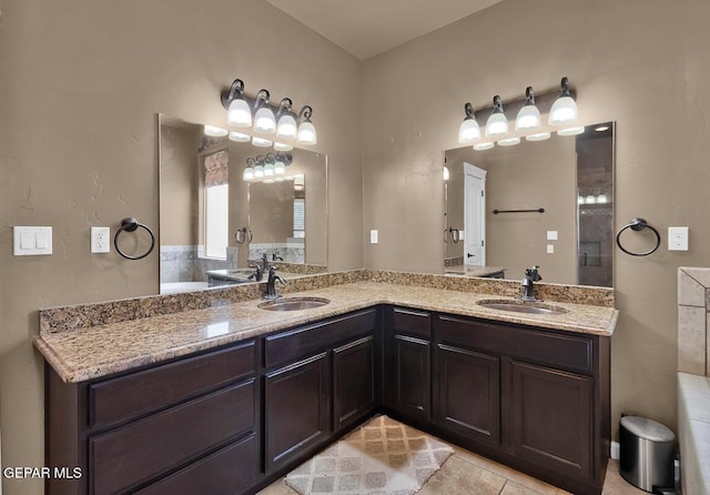 7229 Camino Del Sol Dr, El Paso, TX 79911 - bathroom with double vanity and tile patterned floors