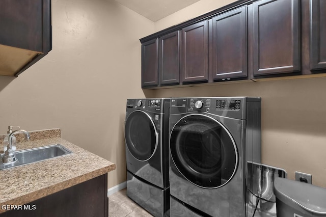 7229 Camino Del Sol Dr, El Paso, TX 79911 - laundry area featuring cabinet space, washer and clothes dryer, and baseboards