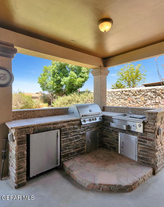 7229 Camino Del Sol Dr, El Paso, TX 79911 - view of patio / terrace featuring a grill, exterior kitchen, and a sink
