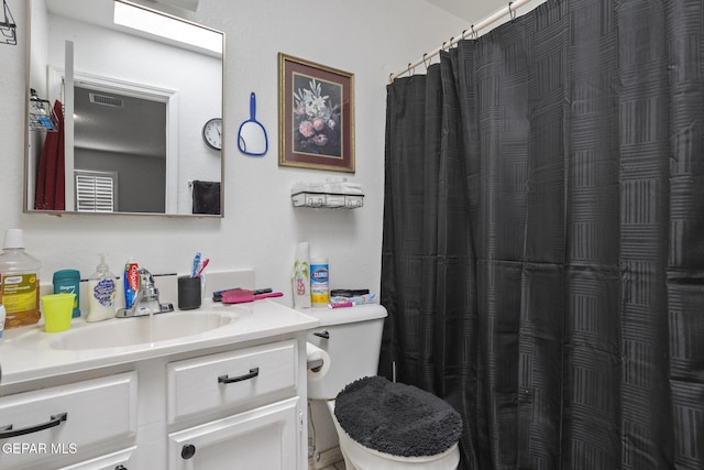 1808 Loanda Ln, El Paso, TX 79928 - bathroom featuring toilet, vanity, a shower with shower curtain, and visible vents