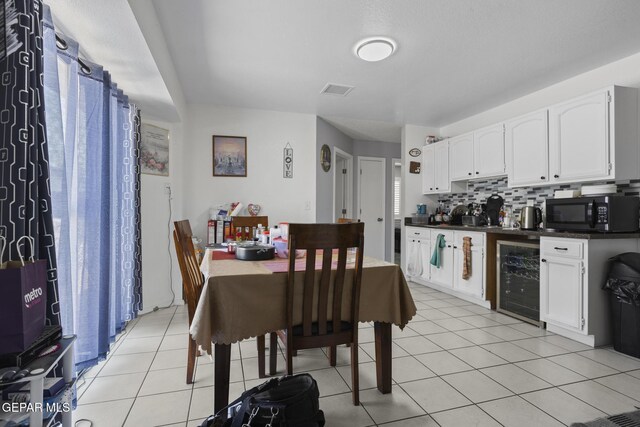 1808 Loanda Ln, El Paso, TX 79928 - dining area with visible vents, light tile patterned floors, and wine cooler