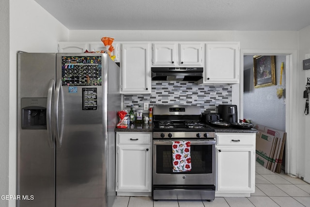 1808 Loanda Ln, El Paso, TX 79928 - kitchen with backsplash, white cabinetry, appliances with stainless steel finishes, under cabinet range hood, and light tile patterned floors