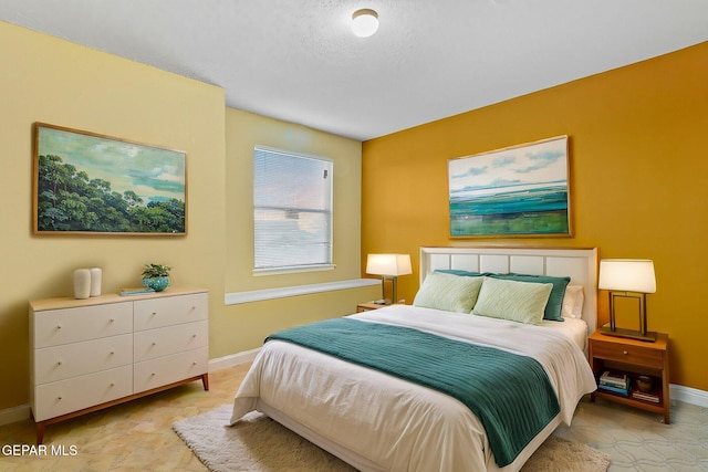 bedroom featuring baseboards
