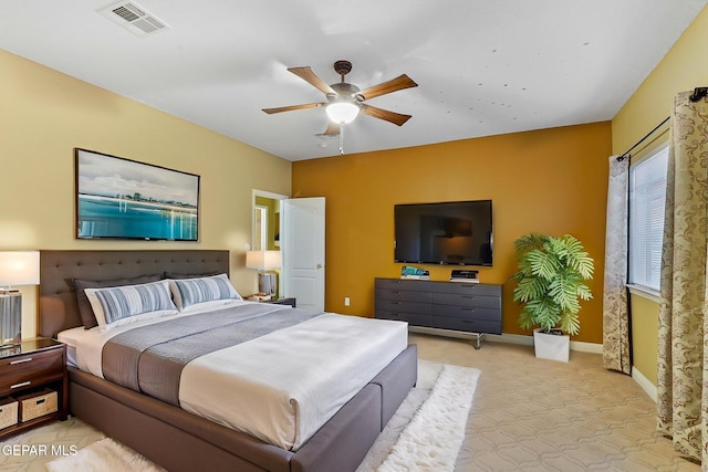 bedroom featuring carpet flooring, a ceiling fan, baseboards, and visible vents