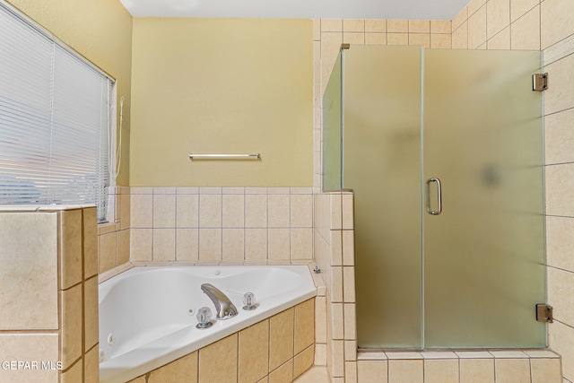full bath featuring a whirlpool tub and a shower stall